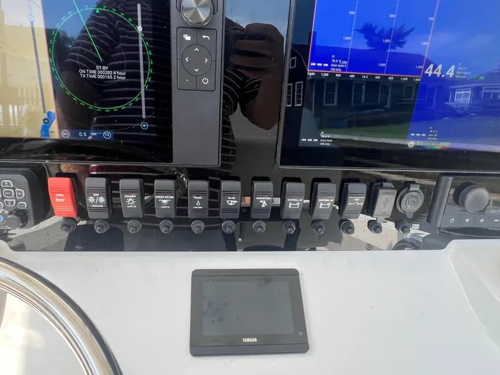  Yacht Photos Pics Control panel of a 2023 Parker 2801 Center Console boat with navigation displays.