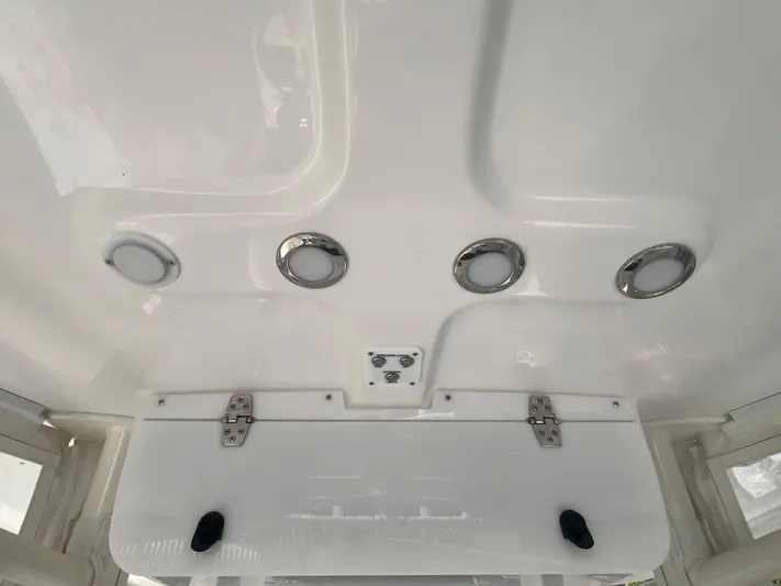  Yacht Photos Pics 2023 Parker 2801 Center Console boat interior with circular lights and storage compartment.