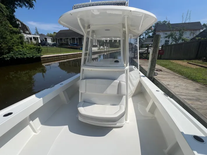  Yacht Photos Pics 2023 Parker 2801 Center Console boat docked by a canal on a sunny day.
