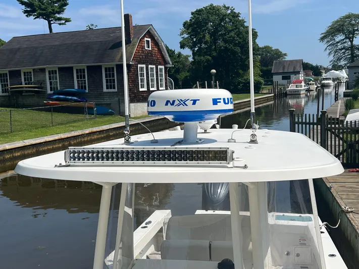  Yacht Photos Pics 2023 Parker 2801 Center Console boat docked near a canal with radar equipment.