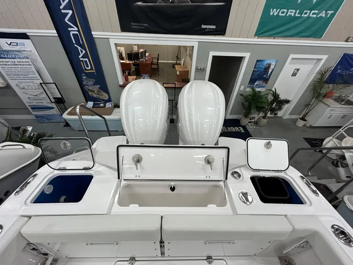  Yacht Photos Pics 2024 Everglades 285 Center Console boat with dual outboard engines in showroom.