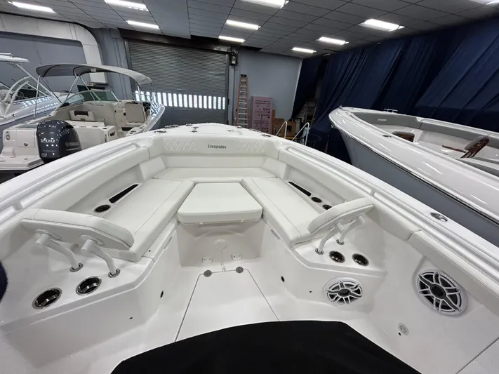  Yacht Photos Pics 2024 Everglades 285 Center Console boat interior with white seating and modern amenities.