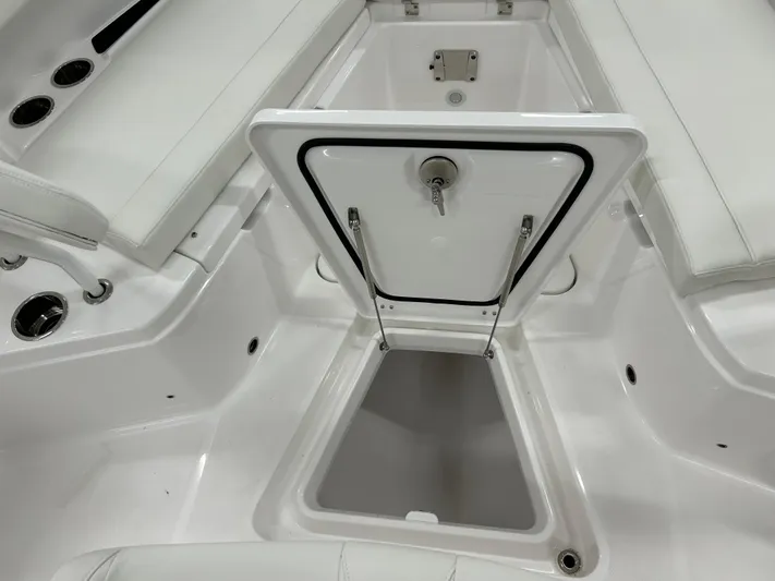  Yacht Photos Pics 2024 Everglades 285 Center Console boat storage compartment with open hatch.