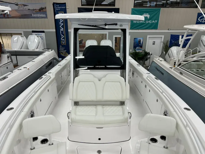  Yacht Photos Pics 2024 Everglades 285 Center Console boat interior with white seating and modern design.