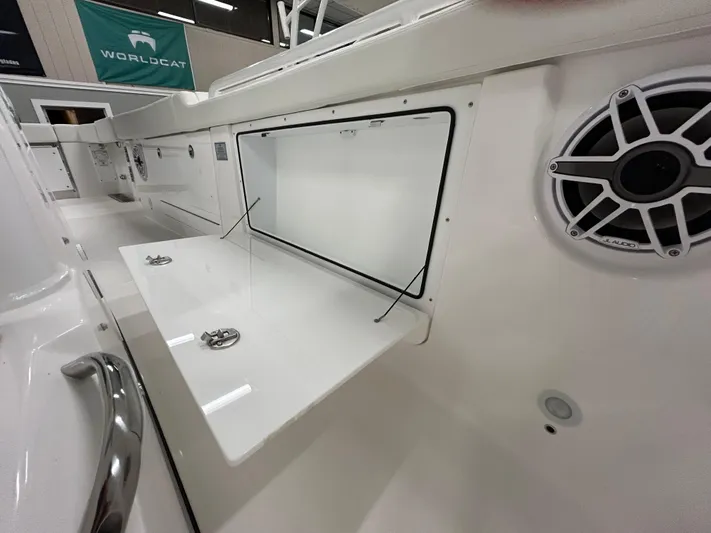  Yacht Photos Pics 2024 Everglades 285 Center Console boat interior with storage compartments and speaker.