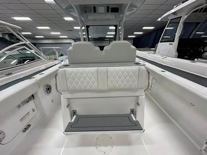  Yacht Photos Pics 2024 Everglades 285 Center Console boat interior with white seating and modern design.