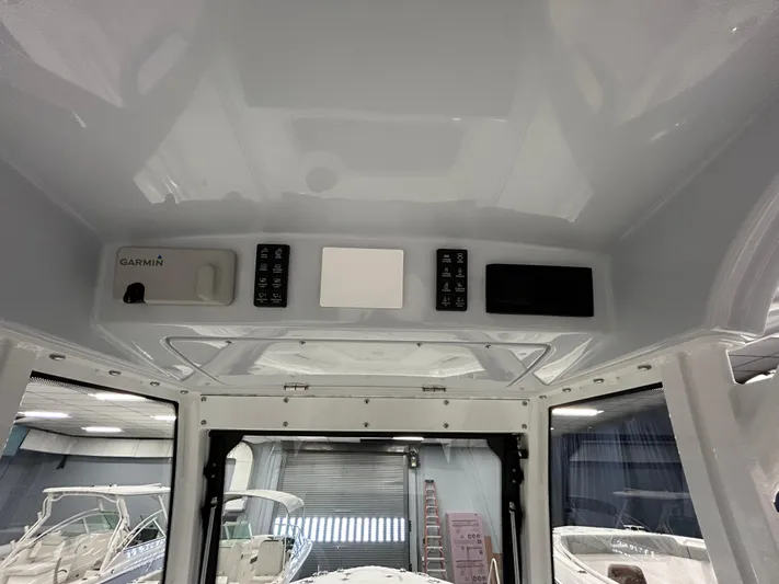  Yacht Photos Pics 2024 Everglades 285 Center Console interior dashboard with Garmin navigation system.