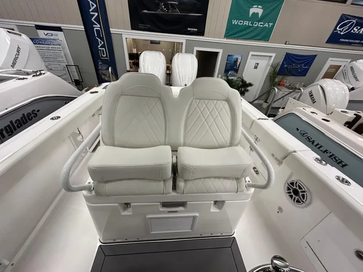  Yacht Photos Pics 2024 Everglades 285 Center Console boat with dual white cushioned seats.