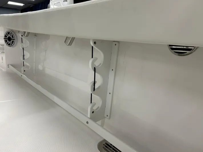  Yacht Photos Pics 2024 Everglades 285 Center Console boat interior with rod holders and speakers.