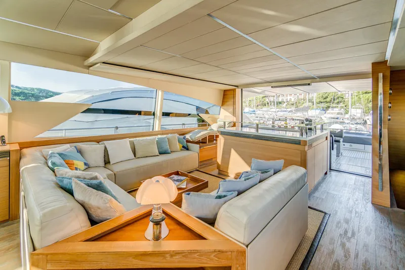  Yacht Photos Pics Luxurious interior of a 2012 Pershing 92 yacht with elegant seating and panoramic windows.