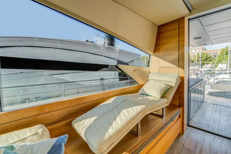  Yacht Photos Pics Luxurious interior of 2012 Pershing 92 yacht with comfortable seating and large window view.