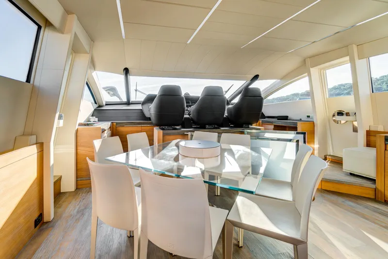  Yacht Photos Pics Luxurious interior of a 2012 Pershing 92 yacht with modern dining area and helm.