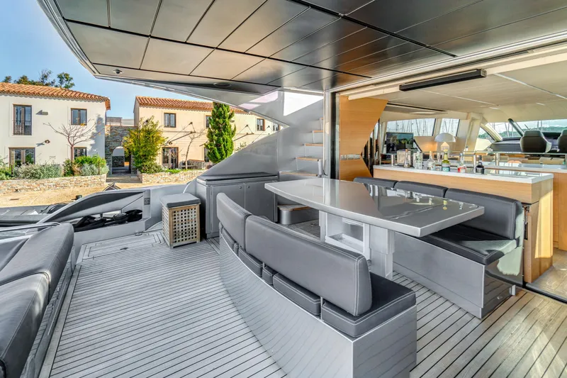  Yacht Photos Pics Luxury 2012 Pershing 92 yacht with sleek outdoor dining area and modern interior design.