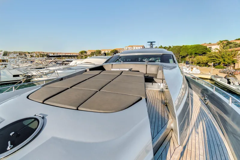  Yacht Photos Pics Luxurious 2012 Pershing 92 yacht docked, showcasing sleek design and spacious deck.