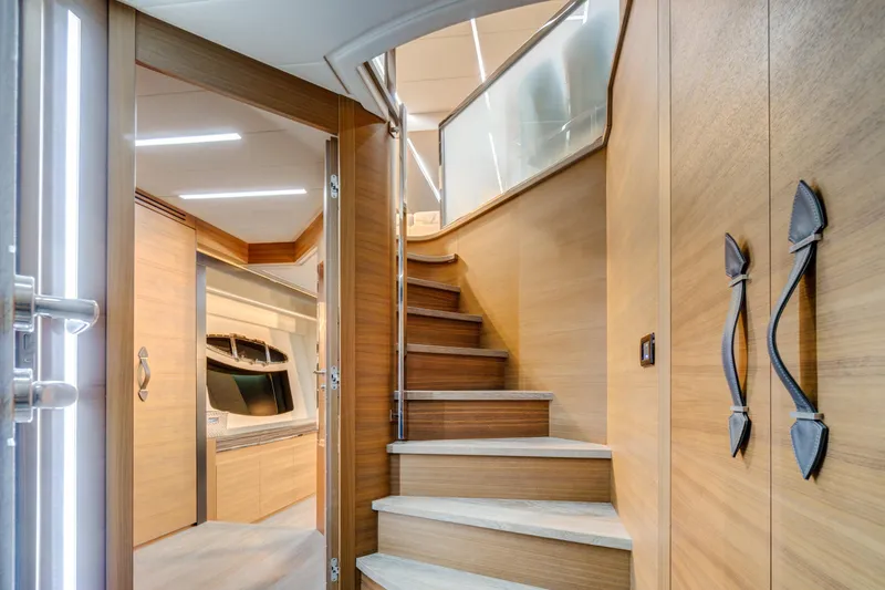  Yacht Photos Pics Interior of 2012 Pershing 92 yacht with wooden stairs and modern design.
