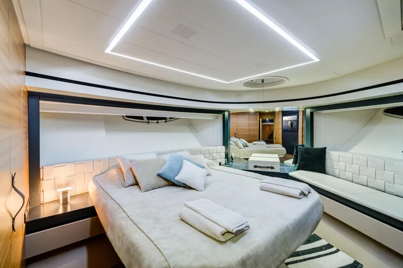  Yacht Photos Pics Luxurious bedroom interior of 2012 Pershing 92 yacht with modern design and ambient lighting.