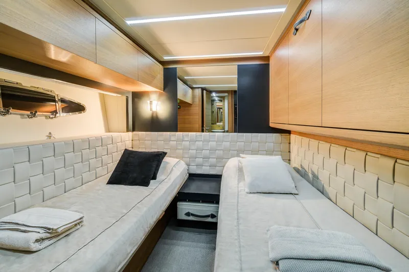  Yacht Photos Pics Luxurious cabin interior of 2012 Pershing 92 yacht with twin beds and modern design.