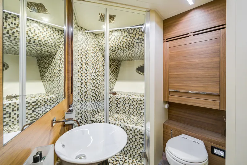  Yacht Photos Pics Luxurious bathroom on 2012 Pershing 92 yacht with modern fixtures and mosaic tiles.