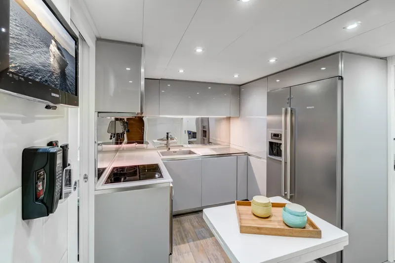  Yacht Photos Pics Luxurious kitchen interior of 2012 Pershing 92 yacht with modern appliances and sleek design.