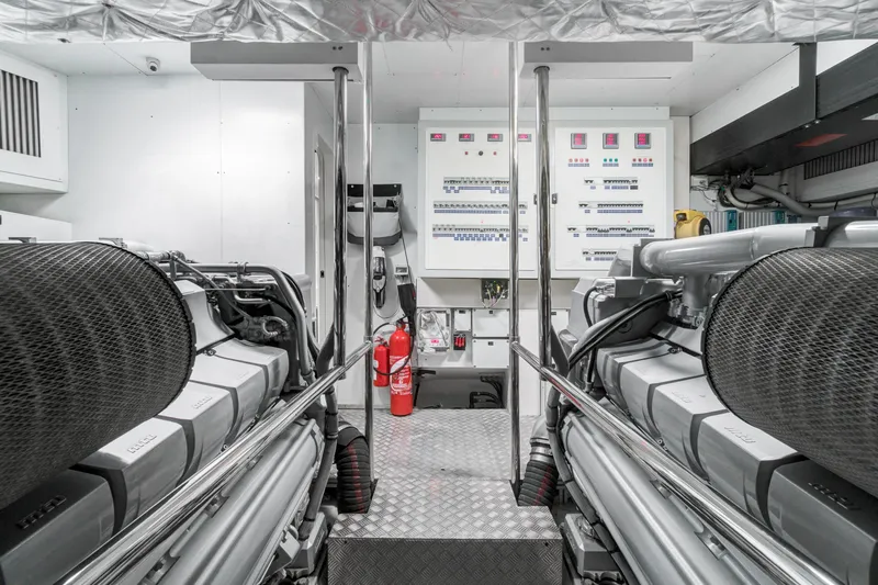  Yacht Photos Pics Engine room of 2012 Pershing 92 yacht with control panels and fire extinguishers.