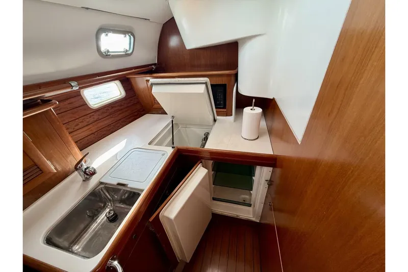 Eda Yacht Photos Pics Interior of 2000 Beneteau Oceanis 461 yacht kitchen with sink and storage.