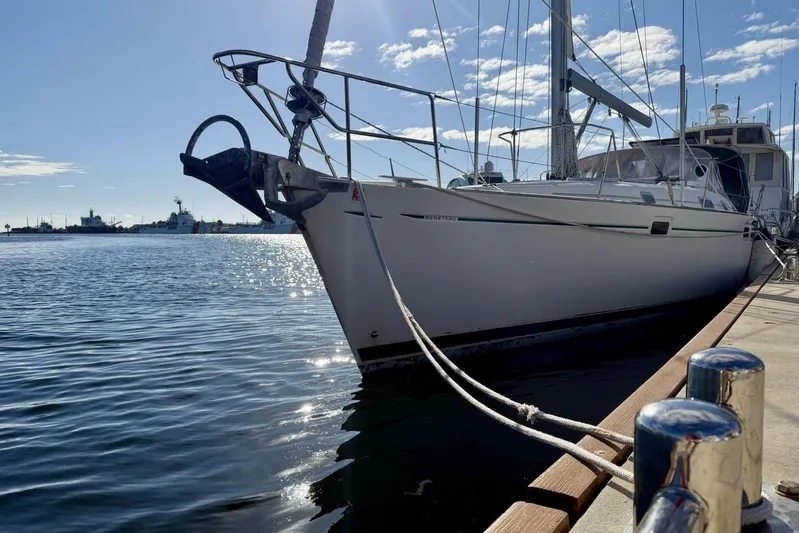 Eda Yacht Photos Pics Sailboat Beneteau Oceanis 461, 2000 model, docked at marina under clear blue sky.