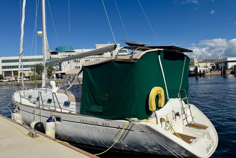 Eda Yacht Photos Pics Beneteau Oceanis 461 sailboat docked, 2000 model, with green canopy and clear sky.