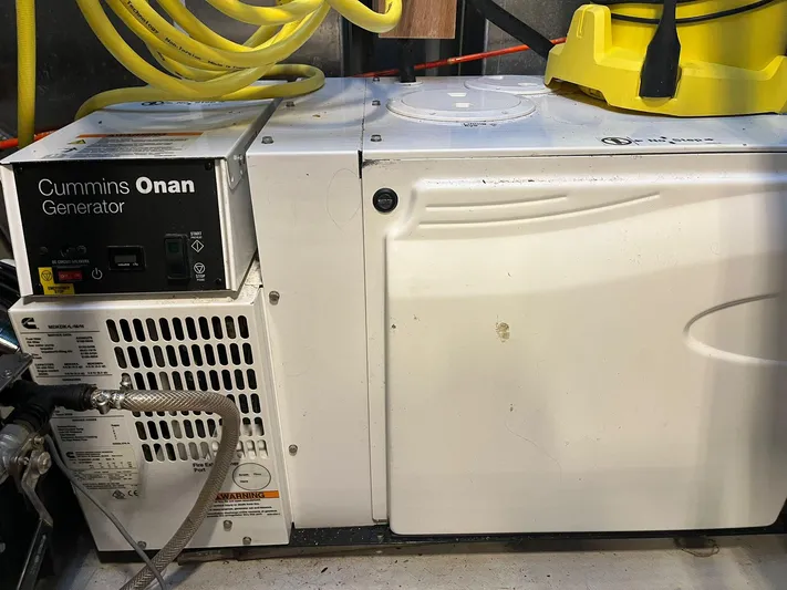  Yacht Photos Pics Cummins Onan generator in a NEEL 51, 2017 model, with yellow cables above.