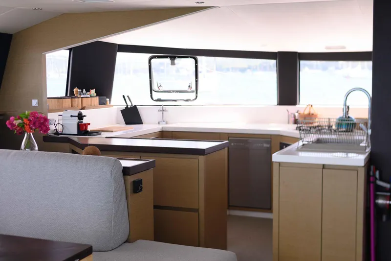  Yacht Photos Pics Modern kitchen interior on 2017 NEEL 51 yacht, featuring sleek countertops and ample natural light.