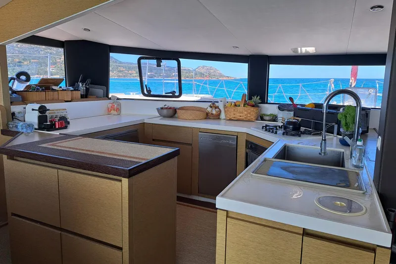  Yacht Photos Pics Modern kitchen interior on a 2017 NEEL 51 yacht with ocean view.