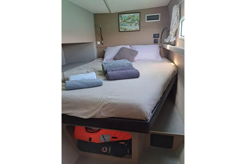  Yacht Photos Pics Cozy bedroom in 2017 NEEL 51 yacht with neatly arranged towels and decor.