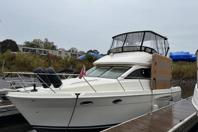 Baby Cake Yacht Photos Pics 2004 Meridian 381 Sedan yacht docked at marina, featuring sleek design and covered flybridge.