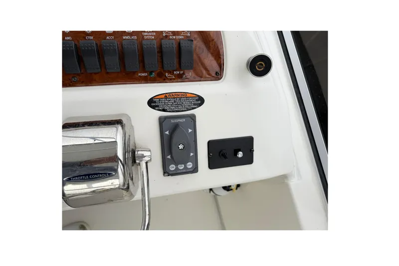 Baby Cake Yacht Photos Pics Control panel of 2004 Meridian 381 Sedan boat with throttle and switches.