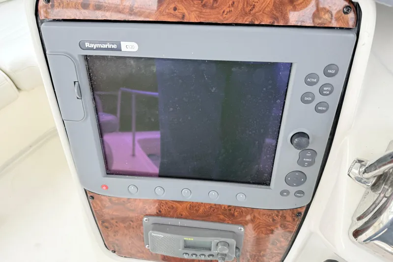 Baby Cake Yacht Photos Pics Raymarine C120 navigation display on 2004 Meridian 381 Sedan boat dashboard.