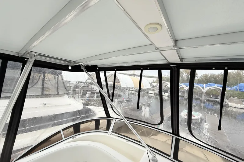 Baby Cake Yacht Photos Pics Interior view of a 2004 Meridian 381 Sedan yacht with marina backdrop.