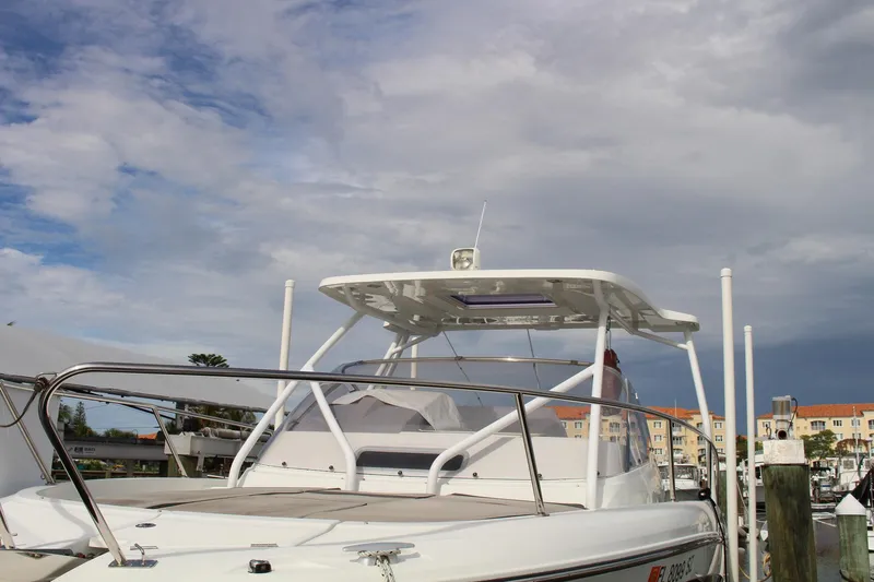 Yacht Photos Pics 2021 Jeanneau Leader 9.0 WA boat docked under cloudy sky.