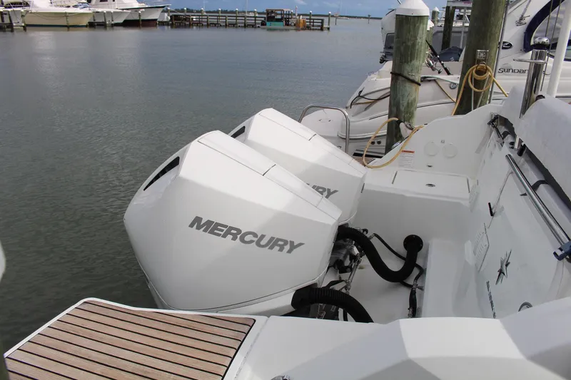  Yacht Photos Pics 2021 Jeanneau Leader 9.0 WA with dual Mercury outboard engines docked at marina.