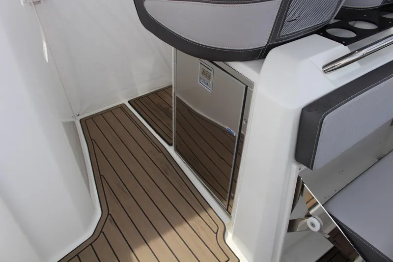  Yacht Photos Pics 2021 Jeanneau Leader 9.0 WA interior with sleek seating and wood-style flooring.