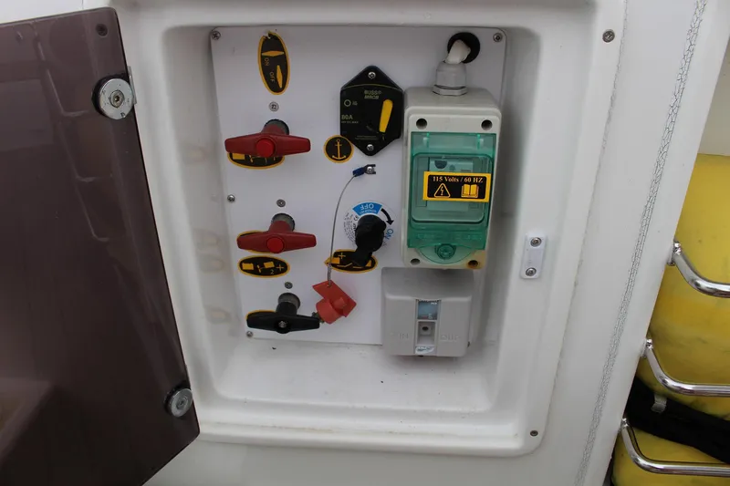  Yacht Photos Pics Electrical control panel on 2021 Jeanneau Leader 9.0 WA boat, featuring switches and voltage indicators.