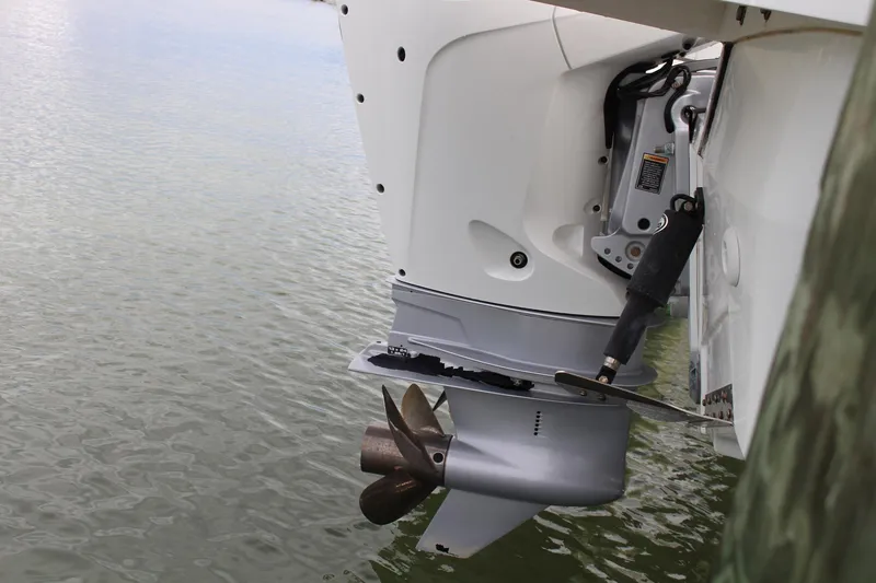  Yacht Photos Pics Outboard motor of 2021 Jeanneau Leader 9.0 WA on water.