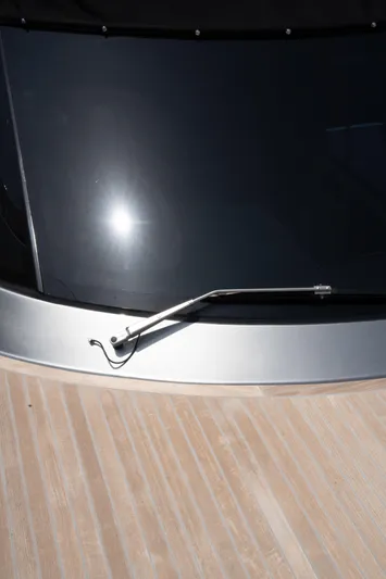 My Life Five III Yacht Photos Pics 2023 Rizzardi GR 63 yacht windshield with sleek design and wooden deck.