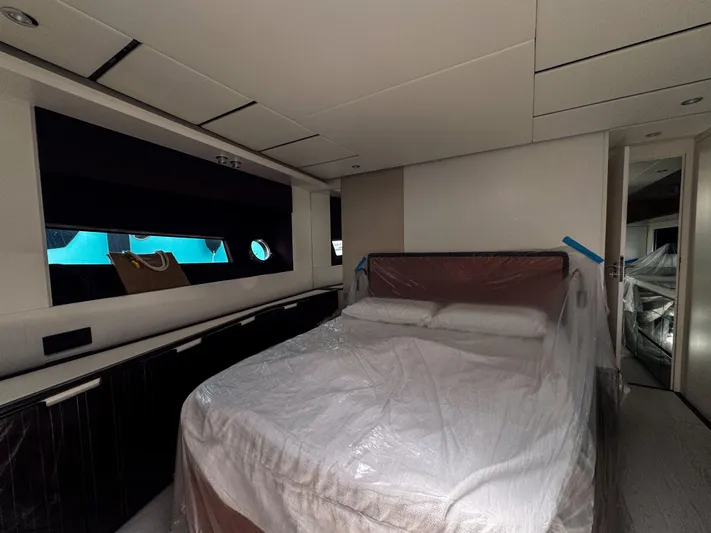 My Life Five III Yacht Photos Pics Luxurious bedroom interior of 2023 Rizzardi GR 63 yacht, featuring a bed and modern design.