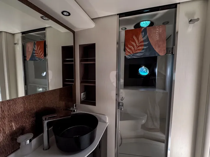 My Life Five III Yacht Photos Pics Luxurious bathroom in 2023 Rizzardi GR 63 yacht with modern fixtures and elegant design.