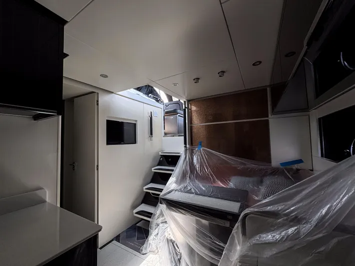 My Life Five III Yacht Photos Pics Interior of 2023 Rizzardi GR 63 yacht, featuring modern design and covered furniture.