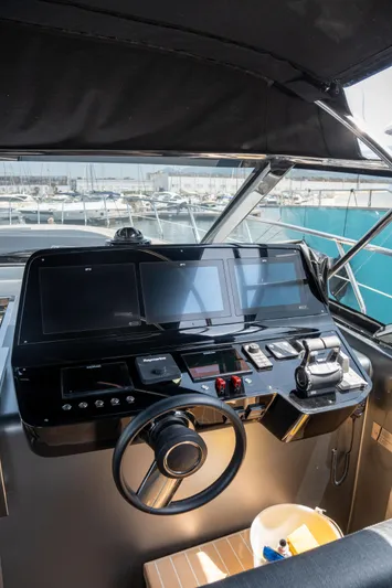 My Life Five III Yacht Photos Pics 2023 Rizzardi GR 63 yacht helm with modern navigation controls and panoramic marina view.