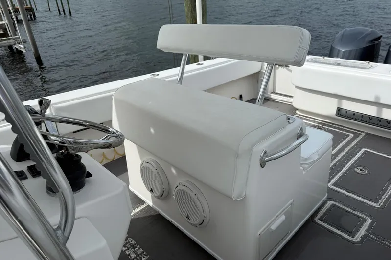  Yacht Photos Pics 2011 Contender 32 ST boat interior with helm seat and steering wheel.