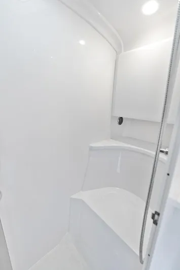  Yacht Photos Pics 2024 Intrepid 41 Valor boat interior, featuring a sleek, modern white bathroom design.
