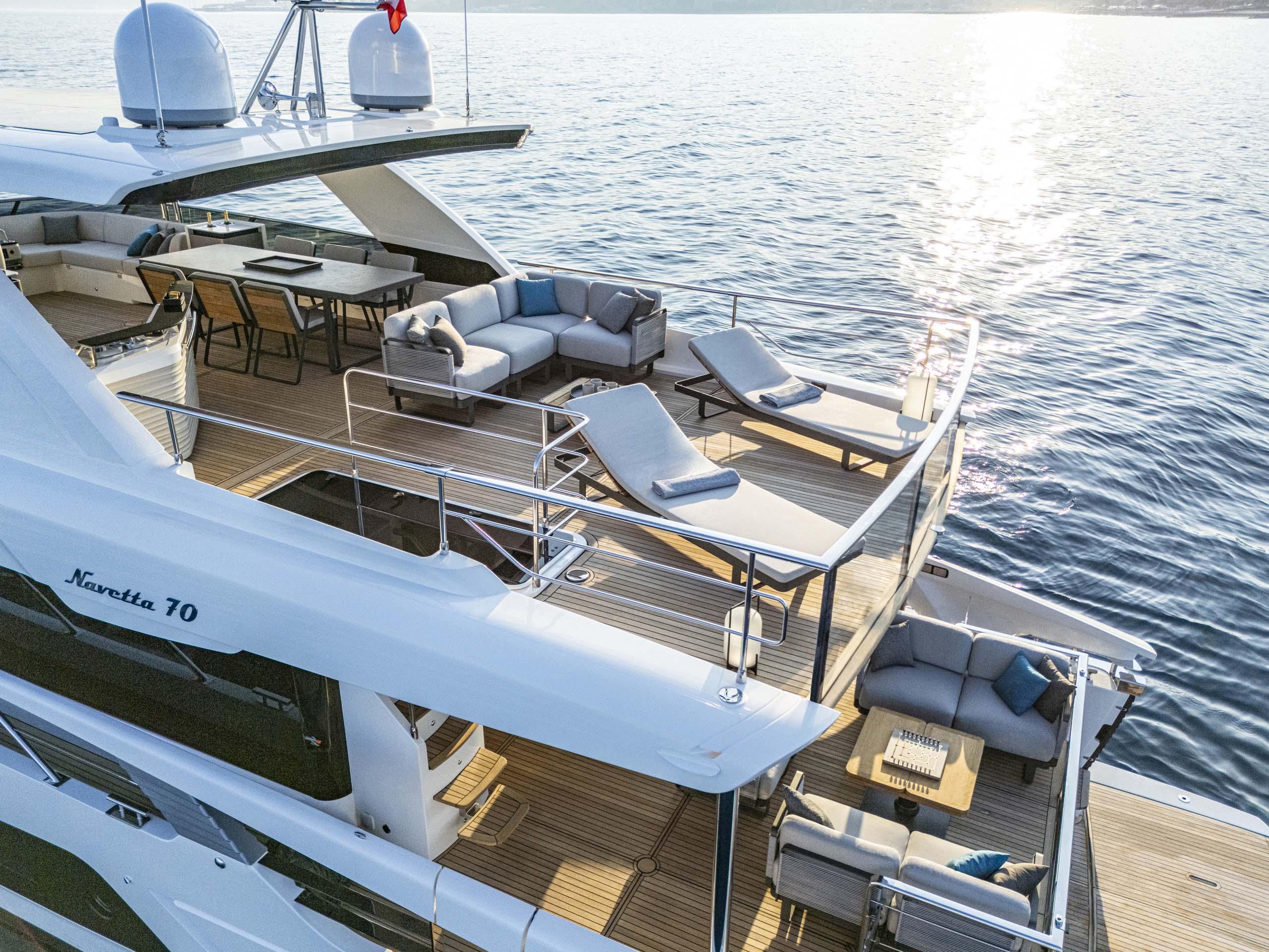 Luxurious 2026 Absolute 70' Navetta yacht with spacious deck and elegant seating.