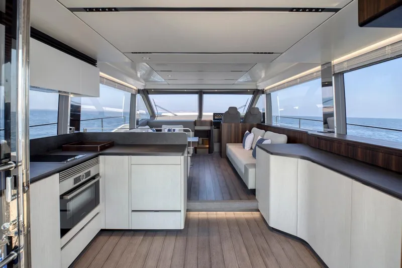 As 5 Yacht Photos Pics Luxurious interior of 2026 Astondoa AS 5 yacht with modern kitchen and seating area.