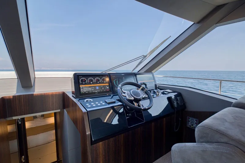 As 5 Yacht Photos Pics 2026 Astondoa AS 5 yacht helm with modern controls and ocean view.
